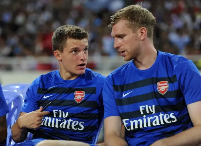 Framed Print : Arsenal Stars Thomas Eisfeld and Per Mertesacker Engage in Pre-Match Chat during Vietnam Friendly, 2013