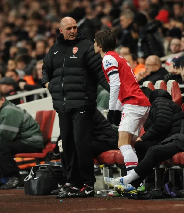Framed Print : Arsenal: Steve Bould Coaches Rosicky on the Sidelines during Arsenal vs Swansea (2012-13) Framed Print : Arsenal: Steve Bould Coaches Rosicky on the Sidelines during Arsenal vs Swansea (2012-13)