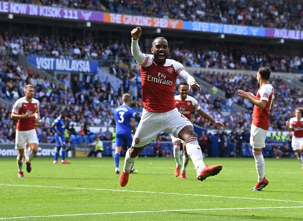 Arsenal Strikers Alexis Lacazette and Pierre-Emerick Aubameyang: Celebrating Goal Scoring Partnership in Premier League Match (Cardiff, 2018-19)