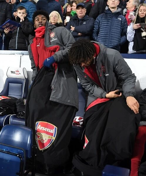 Arsenal Substitutes Ainsley Maitland-Niles and Mohamed Elneny Before West Bromwich Albion Match, 2017-18 Season
