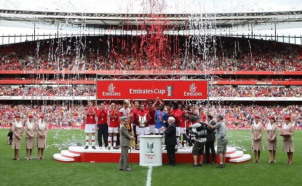 The Arsenal team lift the Emirates Cup Trophy