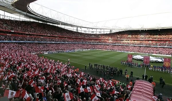 The Arsenal team line up before the match as the fans