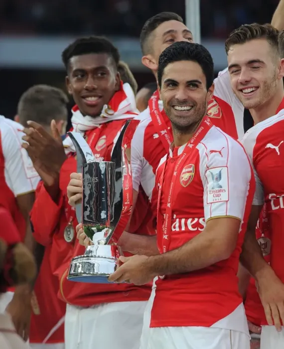 Framed Print : Arsenal Triumph at Emirates Cup: Mikel Arteta's Victory Dance (2015)