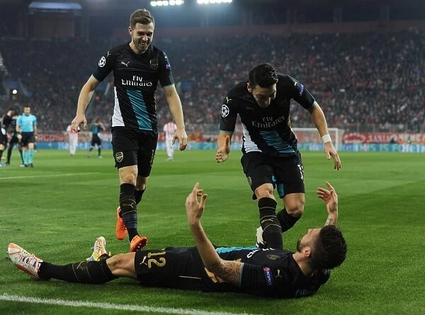 Arsenal Triumph: Giroud, Ramsey, Ozil Celebrate Goals Against Olympiacos in Champions League
