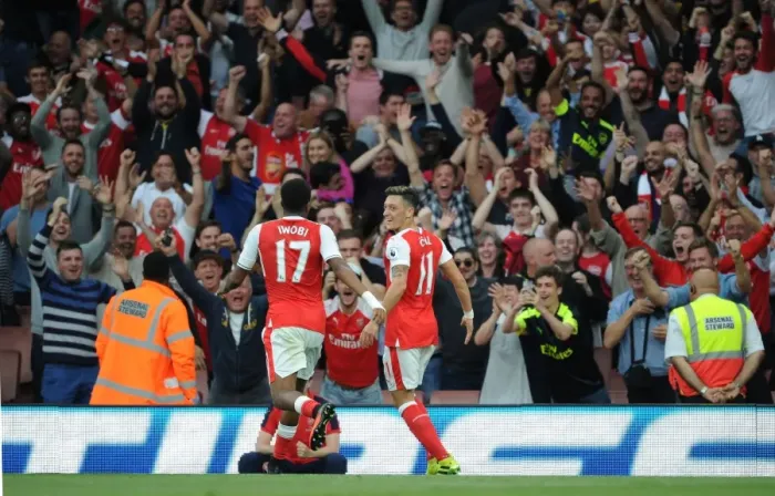 Framed Print : Arsenal Triumph: Mesut Ozil and Alex Iwobi's Goal Celebration vs. Chelsea (2016-17)