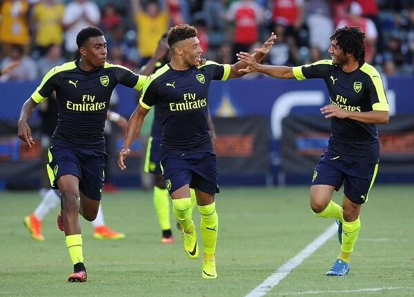 Arsenal Triumph: Oxlade-Chamberlain, Elneny, and Iwobi Celebrate Goals Against Chivas