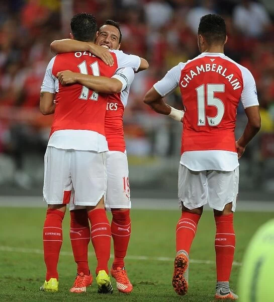 Arsenal Triumph: Ozil, Cazorla, and Oxlade-Chamberlain Celebrate Goal Against Everton at 2015-16 Asia Trophy