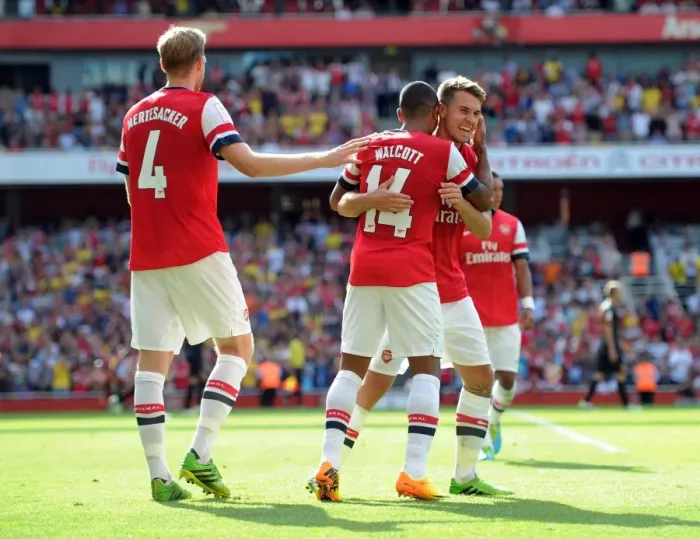 Framed Print : Arsenal Triumph: Walcott, Mertesacker, Ramsey - Celebrating a Goal against Galatasaray (2013-14) Framed Print : Arsenal Triumph: Walcott, Mertesacker, Ramsey - Celebrating a Goal against Galatasaray (2013-14)