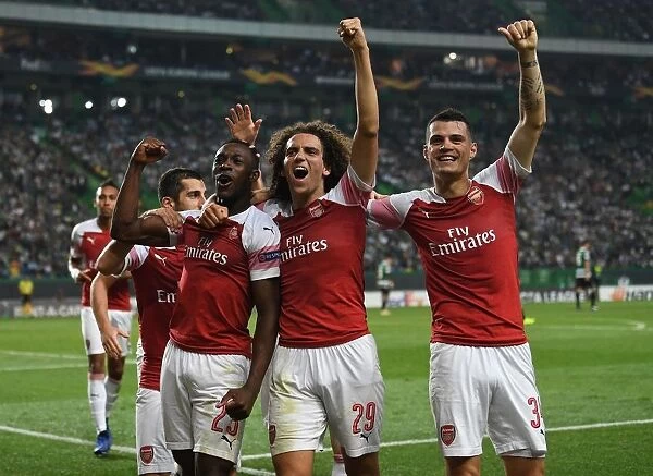 Arsenal Triumph: Welbeck, Guendouzi, and Xhaka Celebrate Goal in Europa League Clash vs Sporting Lisbon (2018-19)