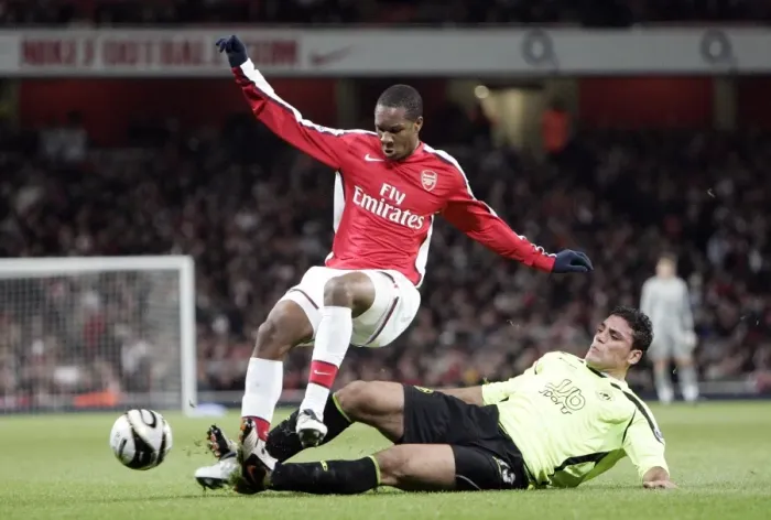 Framed Print : Arsenal Triumphs Over Wigan Athletic 3-0 in Carling Cup: Gavin Hoyte and Amr Zaki Face Off