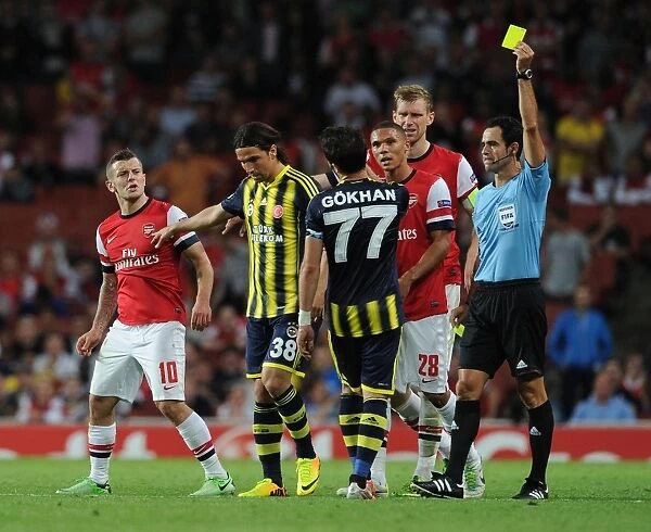 Arsenal v Fenerbahce: Wilshere Fouls Gonul - UEFA Champions League Play-offs Clash