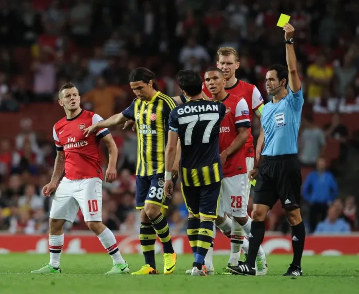 Framed Print : Arsenal v Fenerbahce: Wilshere Fouls Gonul - UEFA Champions League Play-offs Clash Framed Print : Arsenal v Fenerbahce: Wilshere Fouls Gonul - UEFA Champions League Play-offs Clash