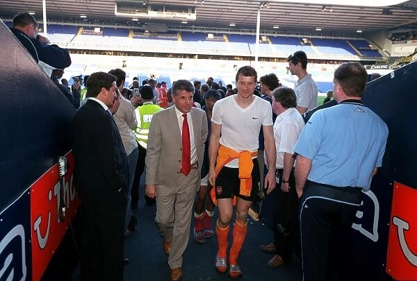 Arsenal Vice Chairman David dein and Jens Lehmann walk up the tunnell at the end of the match