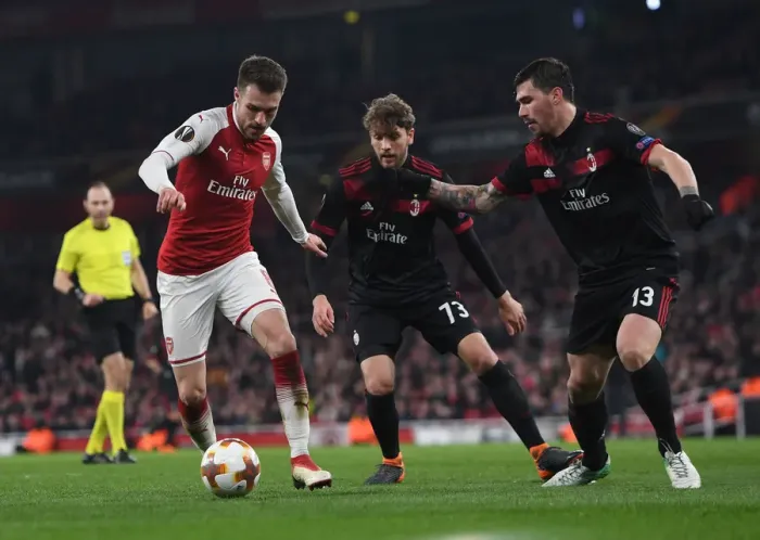 Framed Print : Arsenal vs AC Milan: Clash between Ramsey, Locatelli, and Romagnoli in Europa League Showdown Framed Print : Arsenal vs AC Milan: Clash between Ramsey, Locatelli, and Romagnoli in Europa League Showdown