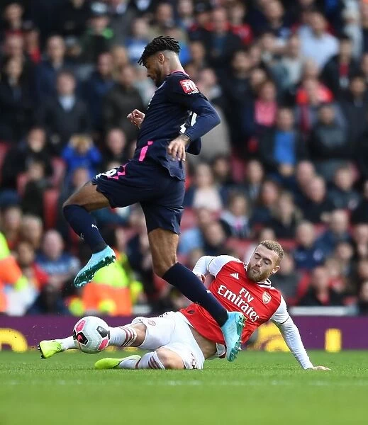 Arsenal vs. AFC Bournemouth: Calum Chambers Tackles Philip Billings in Premier League Clash