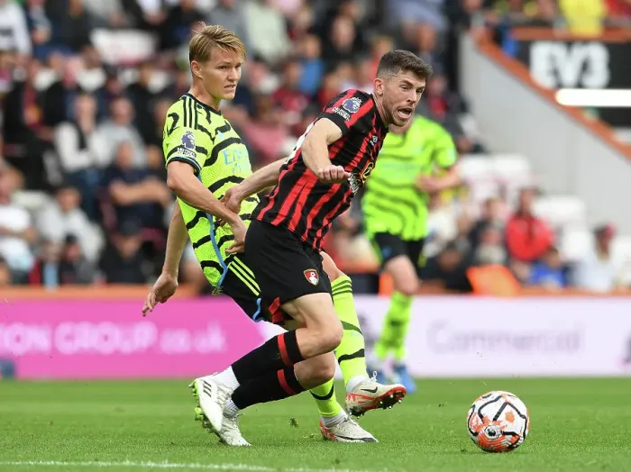 Framed Print : Arsenal vs. AFC Bournemouth: Martin Ødegaard Clashes with Ryan Christie in Premier League Showdown (2023-24)