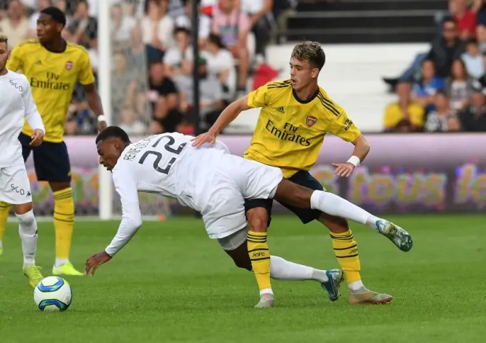 Framed Print : Arsenal vs Angers: Robbie Burton Challenges Jeff Reine-Adelaide in Pre-Season Friendly