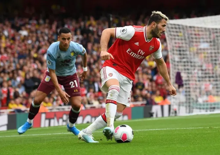 Framed Print : Arsenal vs Aston Villa: Sead Kolasinac Fends Off Anwar El Ghazi in Intense Premier League Clash (2019-20)