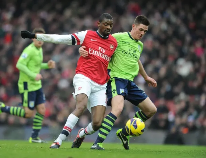 Framed Print : Arsenal vs. Aston Villa: Abou Diaby and Ciaran Clark's Intense Clash on the Emirates Field Framed Print : Arsenal vs. Aston Villa: Abou Diaby and Ciaran Clark's Intense Clash on the Emirates Field