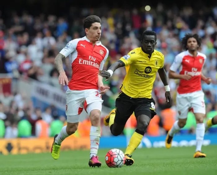 Framed Print : Arsenal vs Aston Villa: Wilshere vs Cissokho - Premier League Clash at Emirates Stadium
