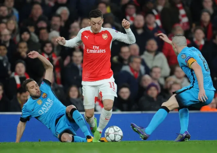 Framed Print : Arsenal vs. Barcelona: Ozil Tackled by Rakitic in Champions League Clash