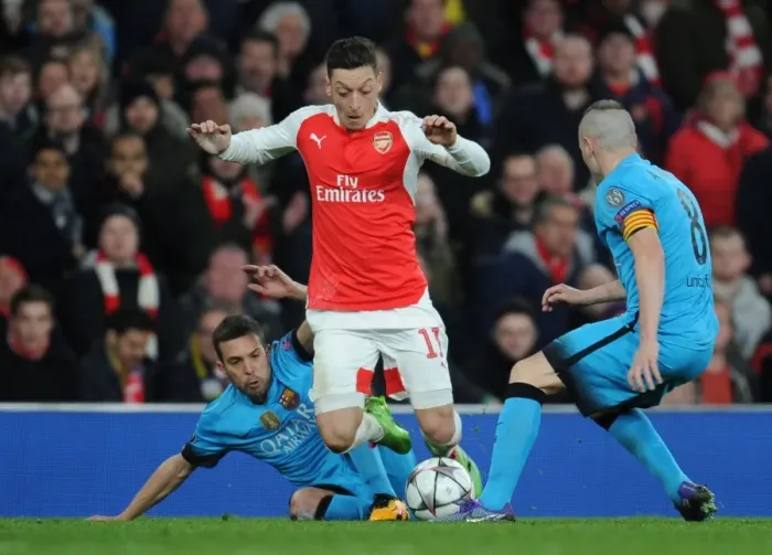 Framed Print : Arsenal vs. Barcelona: Ozil Tripped by Rakitic in Champions League Showdown
