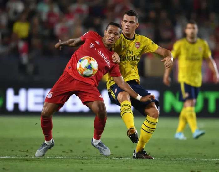 Framed Print : Arsenal vs. Bayern Munich: Granit Xhaka Tackles Coman in Intense International Champions Cup Clash Framed Print : Arsenal vs. Bayern Munich: Granit Xhaka Tackles Coman in Intense International Champions Cup Clash