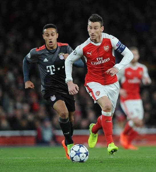 Arsenal vs. Bayern Munich: Koscielny vs. Thiago in UEFA Champions League Showdown