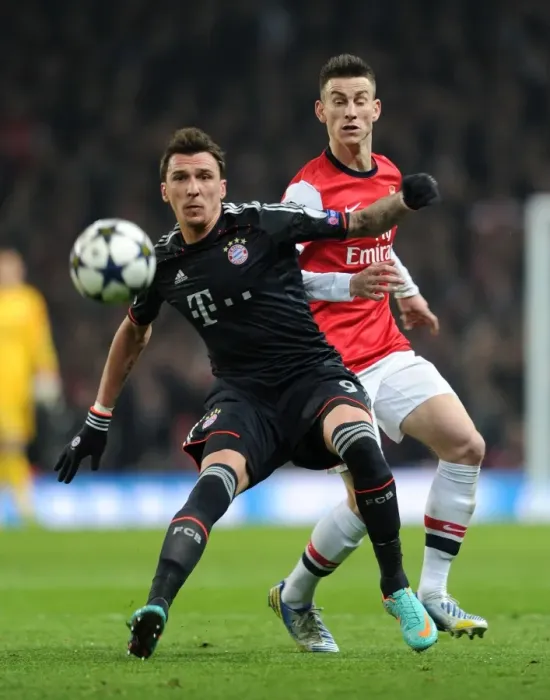 Framed Print : Arsenal vs. Bayern Munich: Koscielny vs. Mandzukic in Champions League Showdown