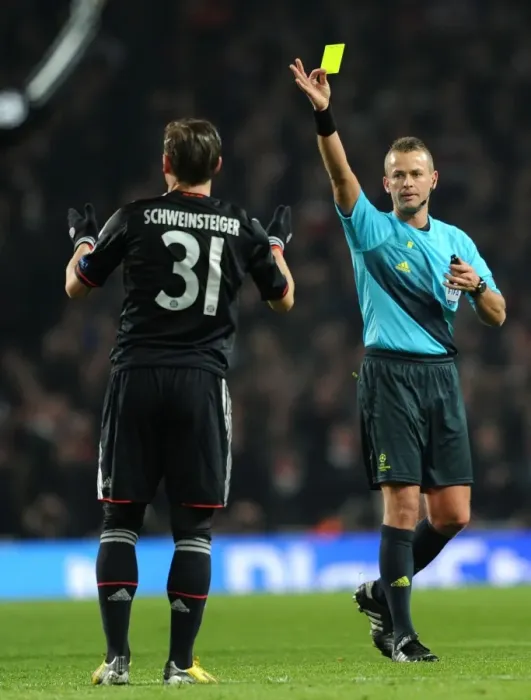 Framed Print : Arsenal vs. Bayern Munich: Referee Shows Yellow Card to Bastian Schweinsteiger in Champions League Clash Framed Print : Arsenal vs. Bayern Munich: Referee Shows Yellow Card to Bastian Schweinsteiger in Champions League Clash