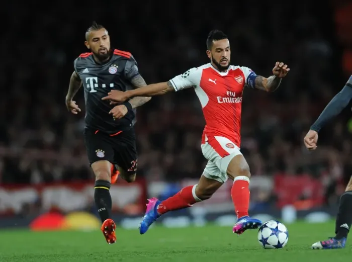 Framed Print : Arsenal vs. Bayern Munich Showdown: Walcott vs. Vidal in UEFA Champions League Battle