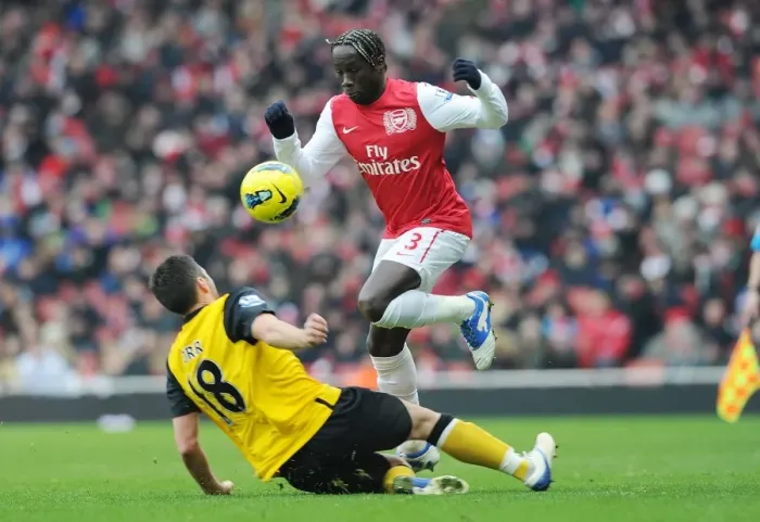 Framed Print : Arsenal vs. Blackburn Rovers: Sagna Soars Over Opponent in Premier League Clash (2011-12) Framed Print : Arsenal vs. Blackburn Rovers: Sagna Soars Over Opponent in Premier League Clash (2011-12)