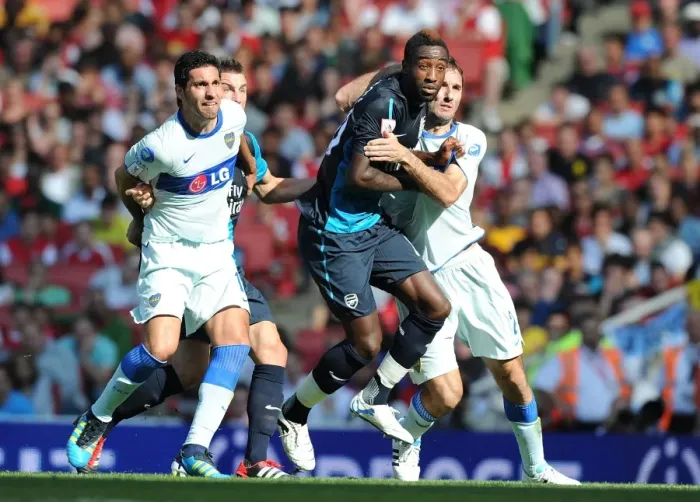 Framed Print : Arsenal vs. Boca Juniors: Johan Djourou Clashes with Rolando Schiavi and Iuan Insaurralde Framed Print : Arsenal vs. Boca Juniors: Johan Djourou Clashes with Rolando Schiavi and Iuan Insaurralde