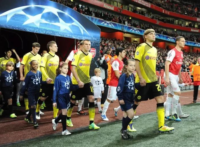 Framed Print : Arsenal vs Borussia Dortmund: Player Escorts in Champions League Clash at Emirates Stadium (2011-12) Framed Print : Arsenal vs Borussia Dortmund: Player Escorts in Champions League Clash at Emirates Stadium (2011-12)