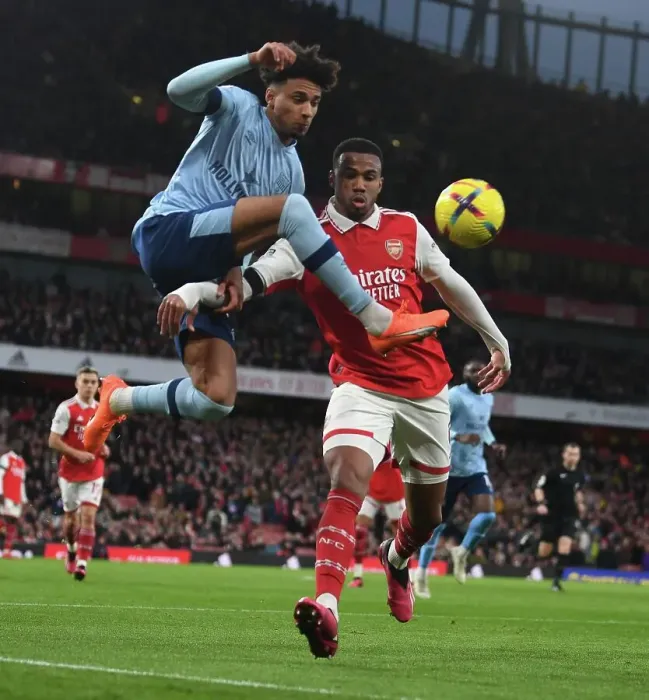 Framed Print : Arsenal vs Brentford: Gabriel Faces Off Against Schade in Intense Premier League Clash