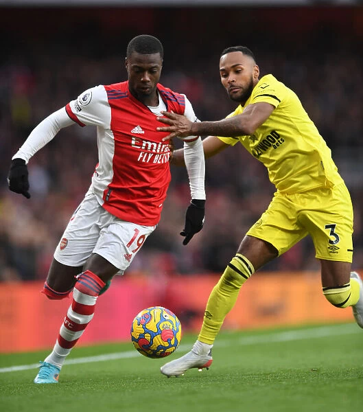 Arsenal vs Brentford: Nicolas Pepe Clashes with Rico Henry in Premier League Showdown