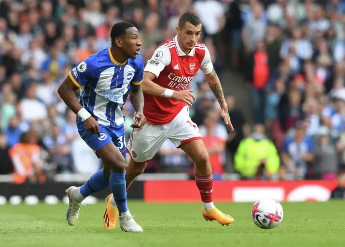 Framed Print : Arsenal vs. Brighton: Jakub Kiwior Closes Down Pervis Estupinan in Intense Premier League Clash (2022-23)