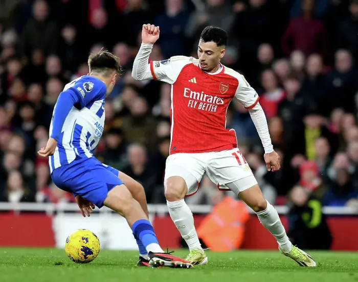 Framed Print : Arsenal vs Brighton: Martinelli Fights for Possession in 2023-24 Premier League Clash