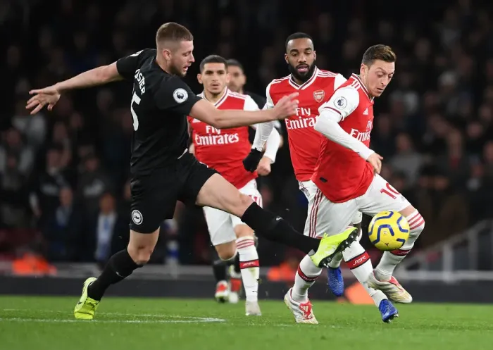 Framed Print : Arsenal vs Brighton: Mesut Ozil Clashes with Adam Webster in Premier League Showdown