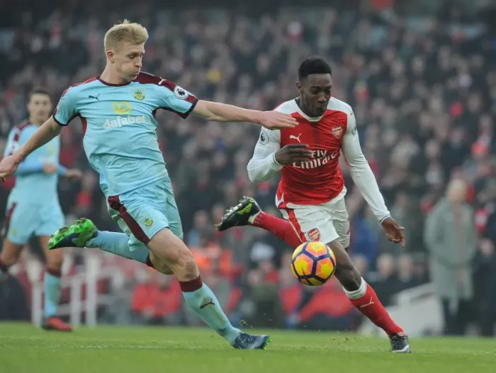 Framed Print : Arsenal vs Burnley: Intense Battle between Welbeck and Mee in the Premier League