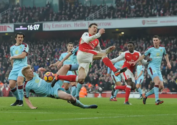 Framed Print : Arsenal vs Burnley: Laurent Koscielny Fouls Ben Mee in Intense Premier League Clash