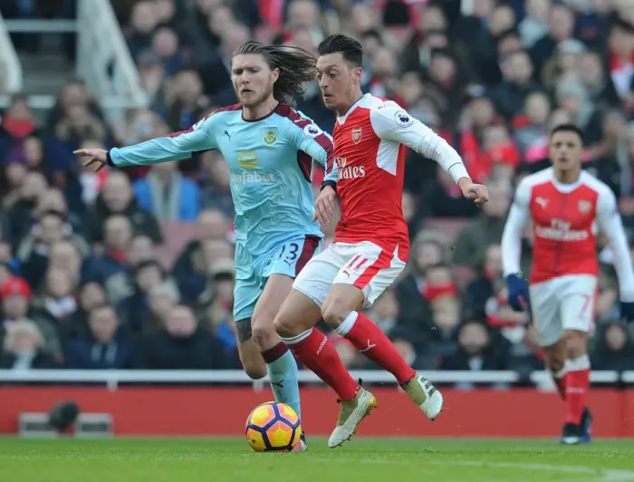 Framed Print : Arsenal vs Burnley: Mesut Ozil Faces Off Against Jeff Hendrick