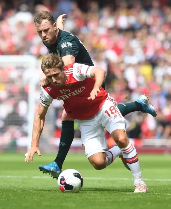 Framed Print : Arsenal vs Burnley: Monreal vs Barnes Clash in Premier League Showdown