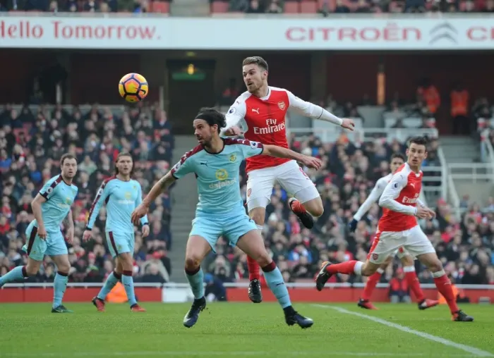 Framed Print : Arsenal vs Burnley: Ramsey vs Boyd Clash in Premier League Showdown