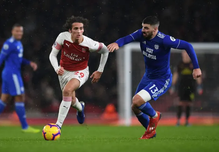 Framed Print : Arsenal vs. Cardiff: Guendouzi Clashes with Paterson in Premier League Showdown