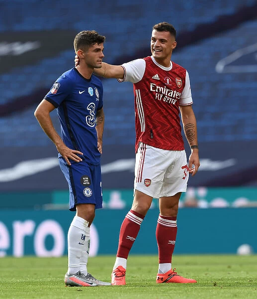 Arsenal vs. Chelsea FA Cup Final: Empty Wembley Showdown - Xhaka and Pulisic's Chat Amidst the Pandemic: A Silent Rivalry