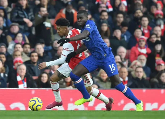 Framed Print : Arsenal vs. Chelsea: A Fiery Premier League Clash - Reiss Nelson vs. Kurt Zouma