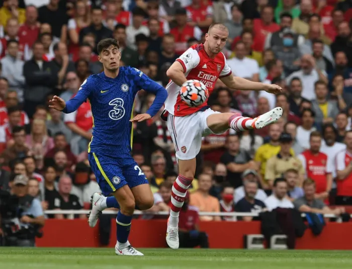 Framed Print : Arsenal vs. Chelsea: Holding Clears Under Pressure in Intense Premier League Clash