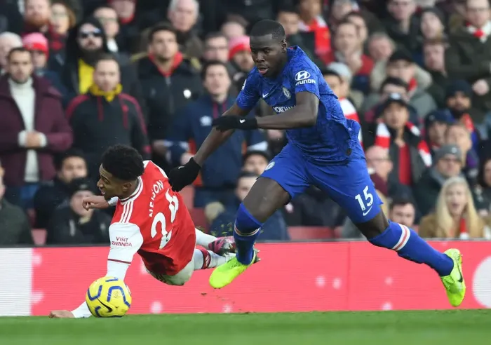 Framed Print : Arsenal vs. Chelsea: Intense Clash at Emirates Stadium - Reiss Nelson vs. Kurt Zouma Framed Print : Arsenal vs. Chelsea: Intense Clash at Emirates Stadium - Reiss Nelson vs. Kurt Zouma