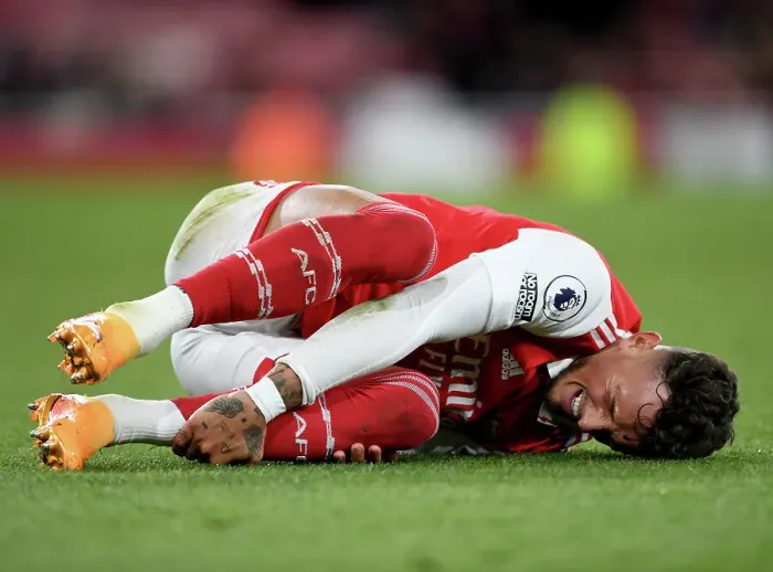 Framed Print : Arsenal vs. Chelsea: Intense Moment as Ben White Clutches His Face in Premier League Showdown, London 2023